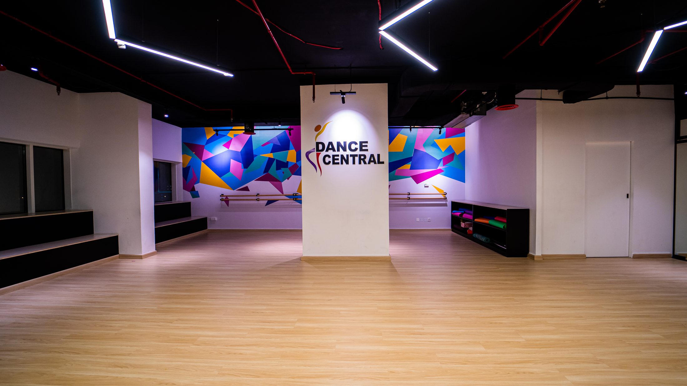 Dance Central Dubai studio entrance with branded wall and colourful mural